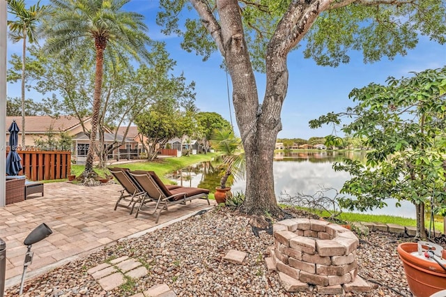 321 NW 100th Ave, Plantation, FL 33324 - view of yard with a fire pit, a water view, and a patio