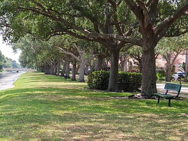 321 NW 100th Ave, Plantation, FL 33324 - view of property's community with a lawn and a water view