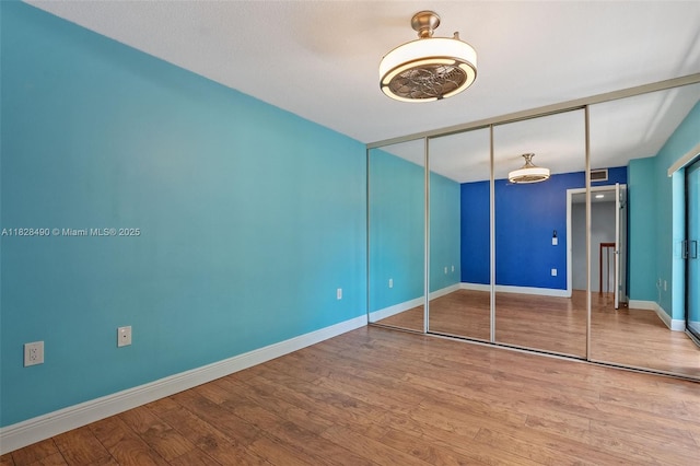 9112A SW 20th St, Davie, FL 33324 - unfurnished bedroom featuring wood finished floors and a closet