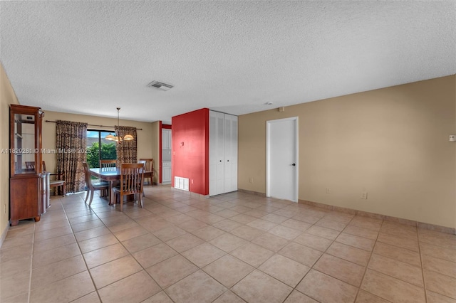 13420 SW 53rd St, Miami, FL 33175 - dining area featuring a chandelier, a textured ceiling, and light tile patterned floors