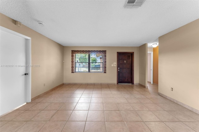 13420 SW 53rd St, Miami, FL 33175 - spare room featuring a textured ceiling, a smoke detector, and light tile patterned flooring