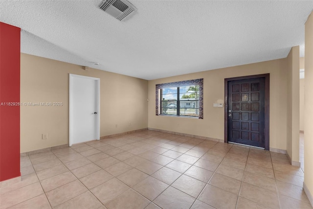 13420 SW 53rd St, Miami, FL 33175 - spare room with a textured ceiling and light tile patterned flooring