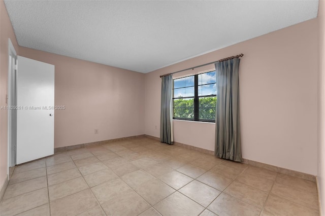 13420 SW 53rd St, Miami, FL 33175 - empty room with light tile patterned floors and baseboards