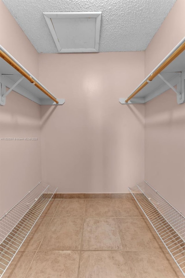 13420 SW 53rd St, Miami, FL 33175 - spacious closet with attic access and tile patterned flooring