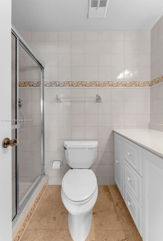 13420 SW 53rd St, Miami, FL 33175 - full bathroom featuring a stall shower, vanity, and tile walls