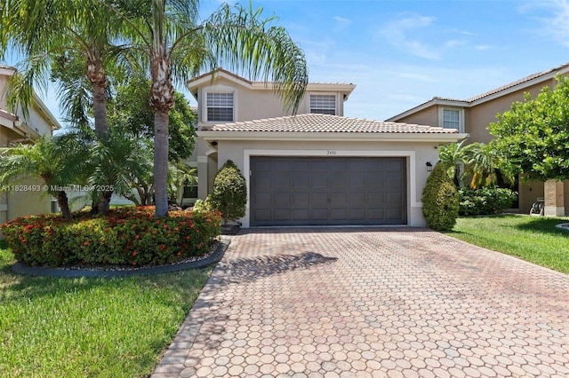 2406 SW 162nd Ter, Miramar, FL 33027 - mediterranean / spanish-style house featuring decorative driveway, stucco siding, a garage, and a tile roof