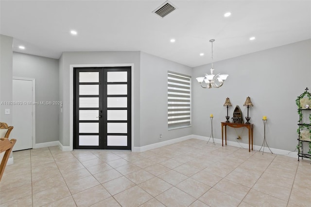2406 SW 162nd Ter, Miramar, FL 33027 - entrance foyer featuring recessed lighting, light tile patterned floors, a chandelier, and french doors
