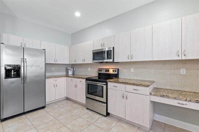 2406 SW 162nd Ter, Miramar, FL 33027 - kitchen with appliances with stainless steel finishes, light tile patterned flooring, decorative backsplash, and light stone countertops