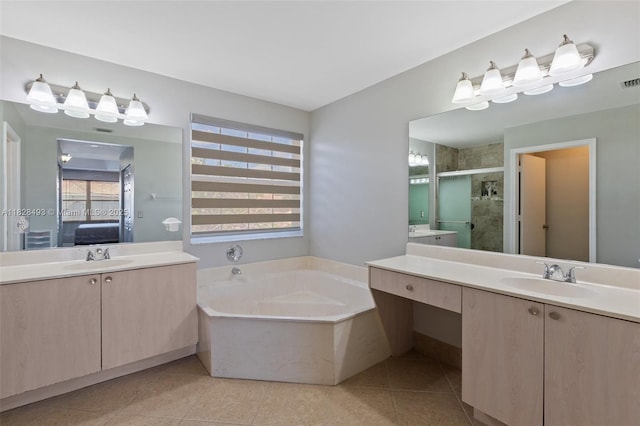 2406 SW 162nd Ter, Miramar, FL 33027 - bathroom with a garden tub, two vanities, a stall shower, connected bathroom, and tile patterned flooring