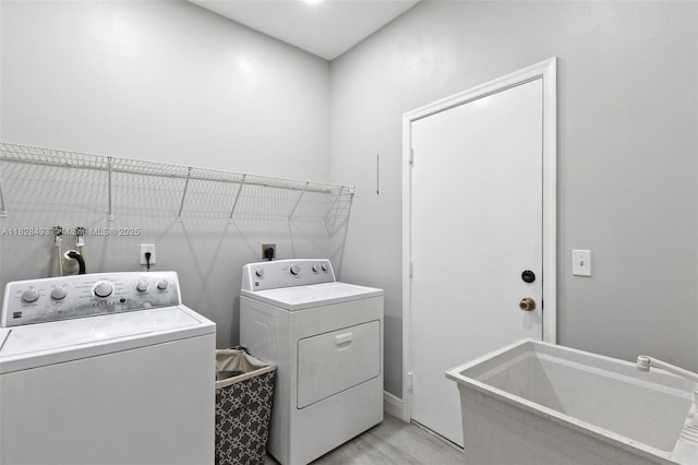 2406 SW 162nd Ter, Miramar, FL 33027 - washroom featuring washing machine and clothes dryer and baseboards