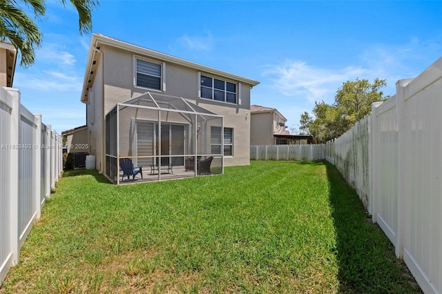 2406 SW 162nd Ter, Miramar, FL 33027 - back of house featuring stucco siding, a fenced backyard, a lanai, and a patio area