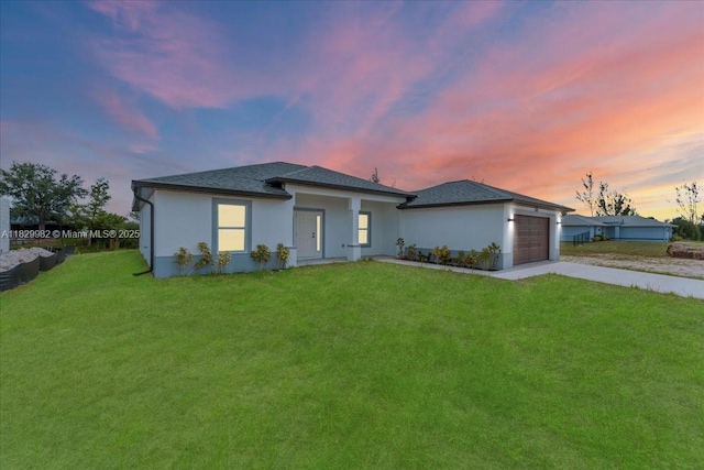 1301 NE 36th Ln, Cape Coral, FL 33909 - view of front facade featuring driveway, a garage, a lawn, stucco siding, and roof with shingles