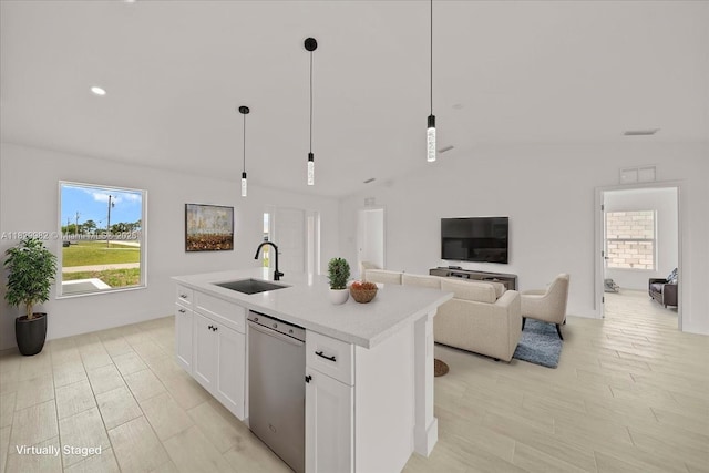 1301 NE 36th Ln, Cape Coral, FL 33909 - kitchen with stainless steel dishwasher, lofted ceiling, light countertops, white cabinets, and a kitchen island with sink