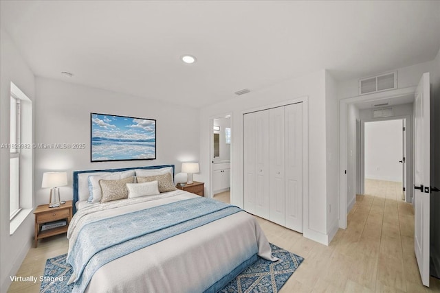1301 NE 36th Ln, Cape Coral, FL 33909 - bedroom featuring a closet, light wood-style floors, and recessed lighting