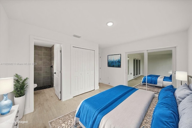 1301 NE 36th Ln, Cape Coral, FL 33909 - bedroom with a closet, light wood-style floors, and ensuite bath