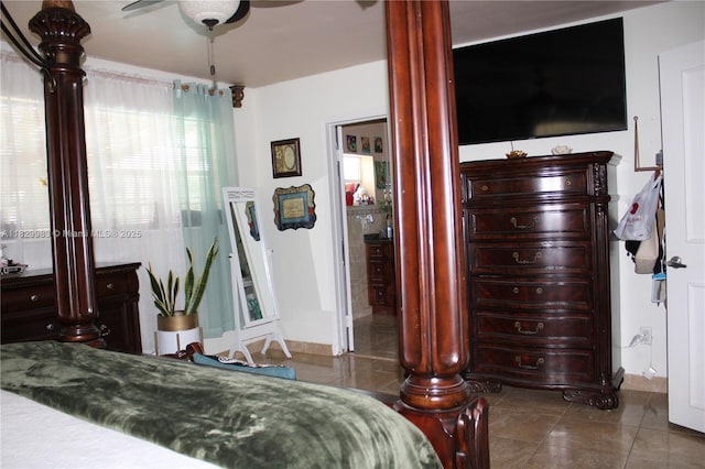 8200 SW 164th St, Palmetto Bay, FL 33157 - tiled bedroom with decorative columns and ceiling fan