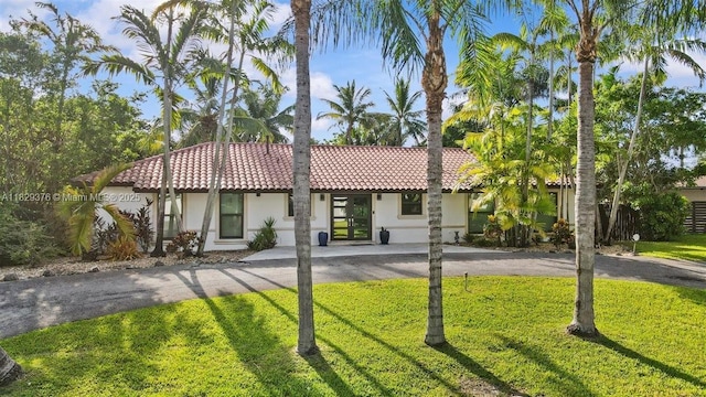 18301 SW 86th Ave, Palmetto Bay, FL 33157 - view of front of property featuring a tiled roof, stucco siding, and a front yard
