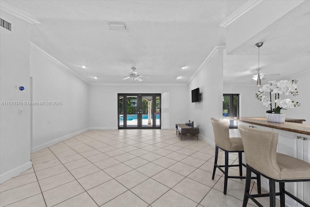 18301 SW 86th Ave, Palmetto Bay, FL 33157 - kitchen featuring a ceiling fan, french doors, crown molding, open floor plan, and light tile patterned flooring