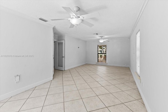 18301 SW 86th Ave, Palmetto Bay, FL 33157 - spare room with crown molding, a ceiling fan, and light tile patterned floors