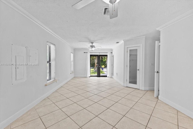 18301 SW 86th Ave, Palmetto Bay, FL 33157 - empty room featuring ceiling fan, crown molding, french doors, a textured ceiling, and light tile patterned floors