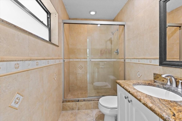 18301 SW 86th Ave, Palmetto Bay, FL 33157 - bathroom featuring tile walls, vanity, a stall shower, and tile patterned flooring