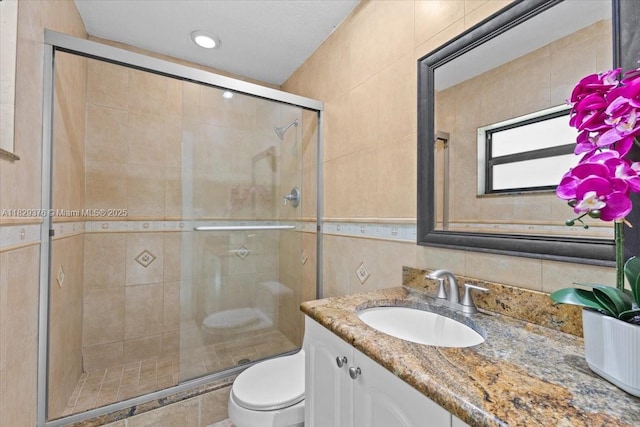 18301 SW 86th Ave, Palmetto Bay, FL 33157 - bathroom with tile walls, vanity, and a stall shower