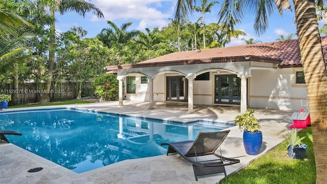 18301 SW 86th Ave, Palmetto Bay, FL 33157 - view of swimming pool featuring french doors and a patio area