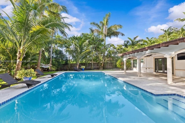 18301 SW 86th Ave, Palmetto Bay, FL 33157 - view of swimming pool with french doors and a patio area