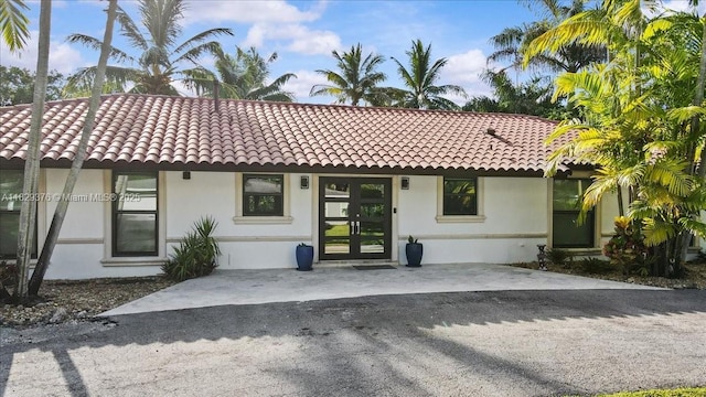 18301 SW 86th Ave, Palmetto Bay, FL 33157 - view of front facade with stucco siding and a tiled roof