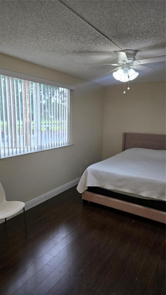 7500 NW 17th St Unit 101, Plantation, FL 33313 - bedroom featuring hardwood / wood-style floors, ceiling fan, and a textured ceiling