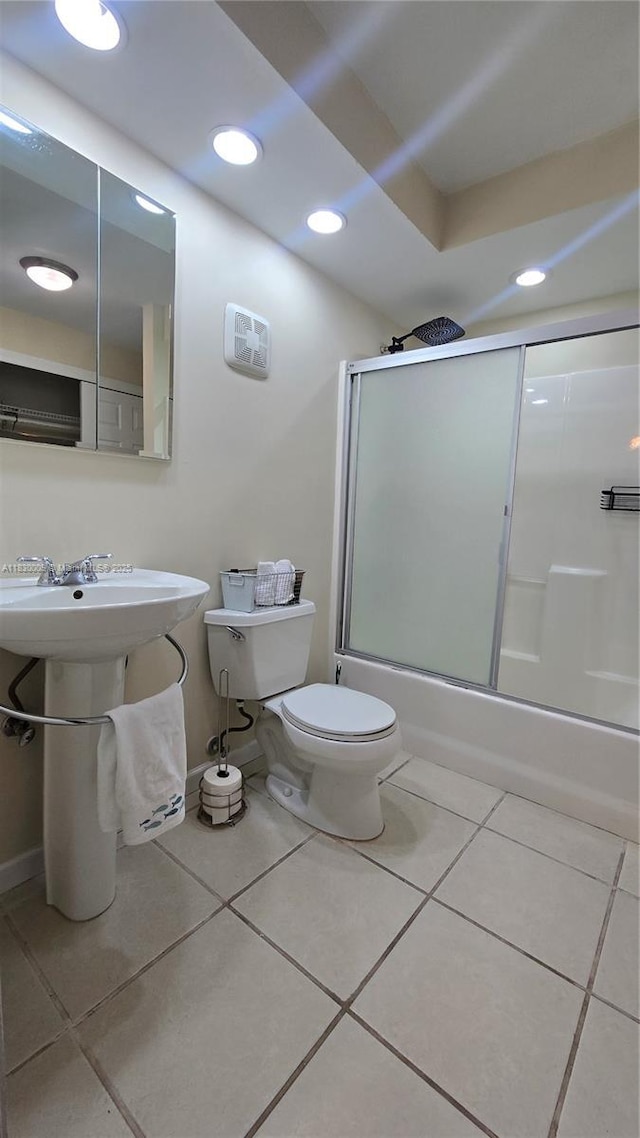 7500 NW 17th St Unit 101, Plantation, FL 33313 - bathroom featuring bath / shower combo with glass door, tile patterned flooring, and recessed lighting