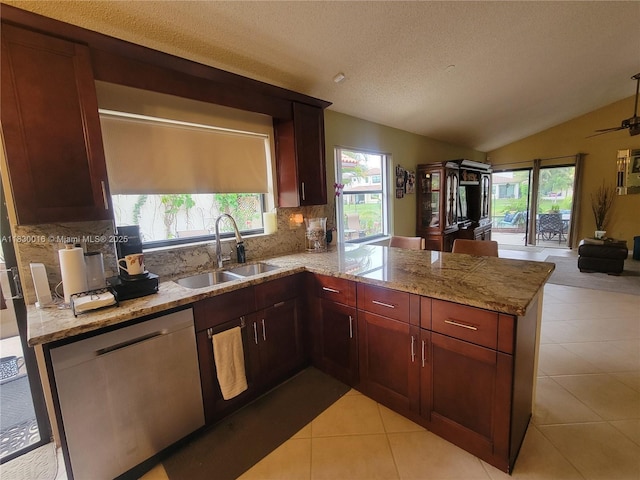 810 SW 113th Ter, Pembroke Pines, FL 33025 - kitchen featuring stainless steel dishwasher, a peninsula, tasteful backsplash, lofted ceiling, and plenty of natural light