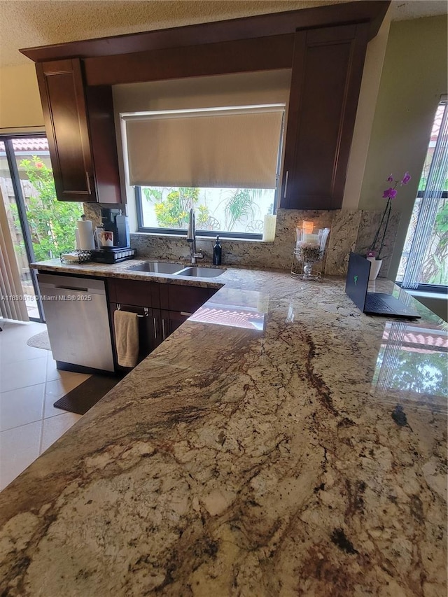 810 SW 113th Ter, Pembroke Pines, FL 33025 - kitchen with dishwasher, tasteful backsplash, light stone countertops, and dark brown cabinets