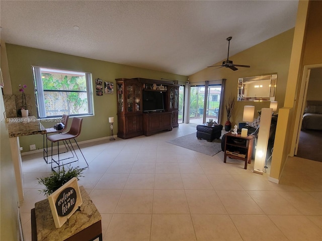 810 SW 113th Ter, Pembroke Pines, FL 33025 - living area with plenty of natural light, a ceiling fan, vaulted ceiling, and tile patterned floors