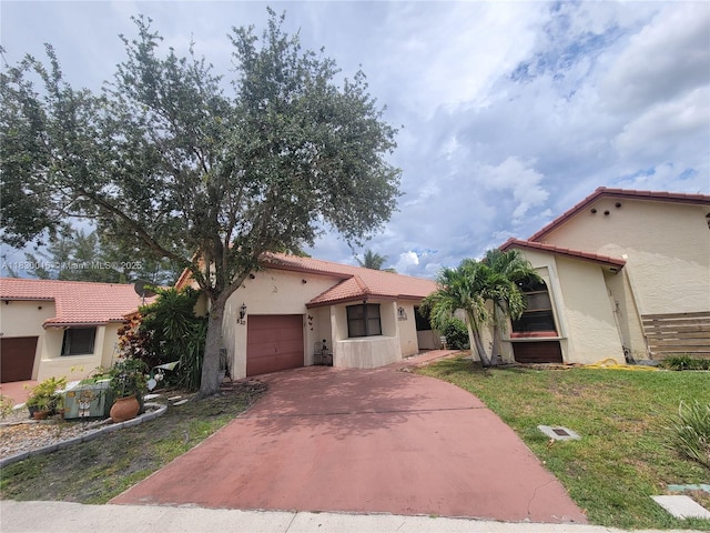 810 SW 113th Ter, Pembroke Pines, FL 33025 - mediterranean / spanish home with stucco siding, an attached garage, concrete driveway, a tile roof, and a front lawn