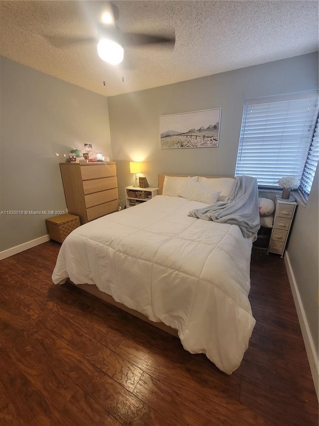 810 SW 113th Ter, Pembroke Pines, FL 33025 - bedroom with a textured ceiling, dark wood-type flooring, and a ceiling fan