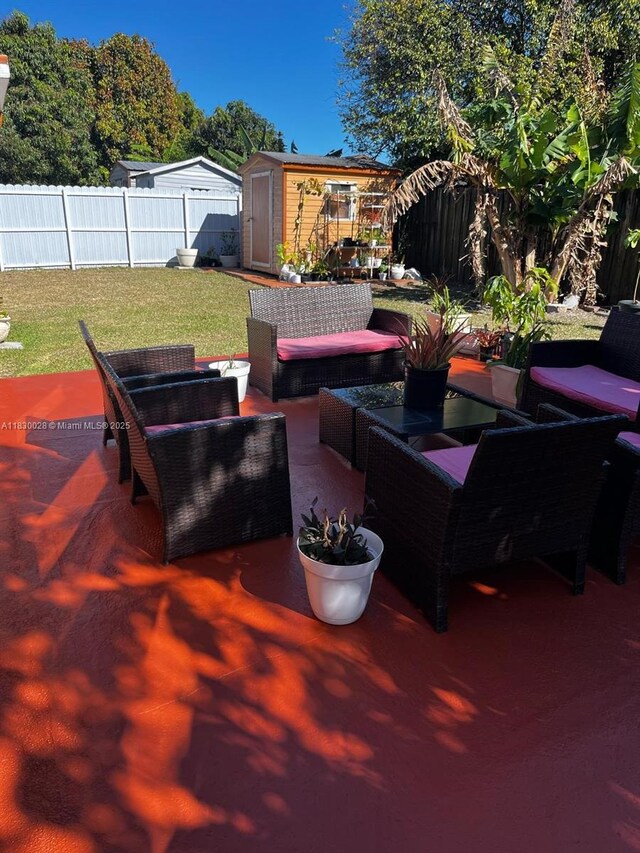 11024 SW 157th Ter, Miami, FL 33157 - fenced backyard featuring a shed, an outdoor hangout area, and a patio area
