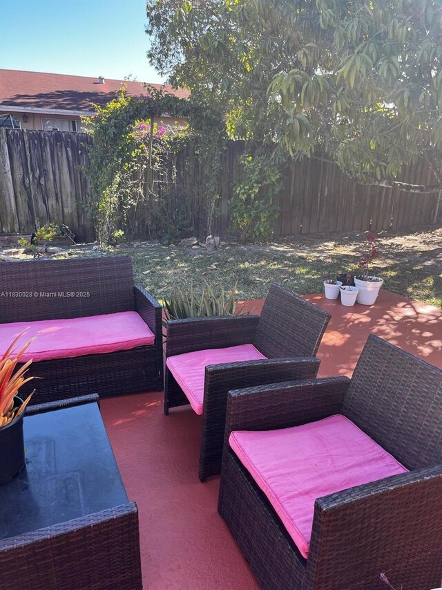 11024 SW 157th Ter, Miami, FL 33157 - fenced backyard featuring a patio area and outdoor lounge area