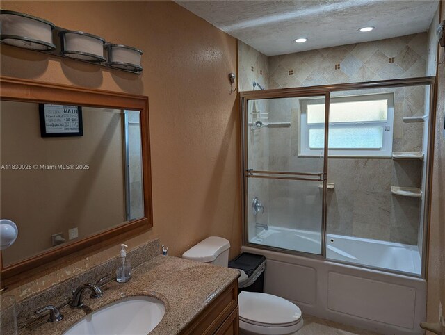 11024 SW 157th Ter, Miami, FL 33157 - bathroom with vanity, shower / bath combination with glass door, and a textured ceiling