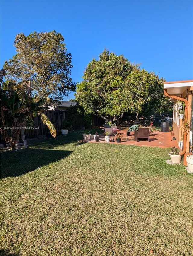 11024 SW 157th Ter, Miami, FL 33157 - view of yard featuring a patio and an outdoor living space