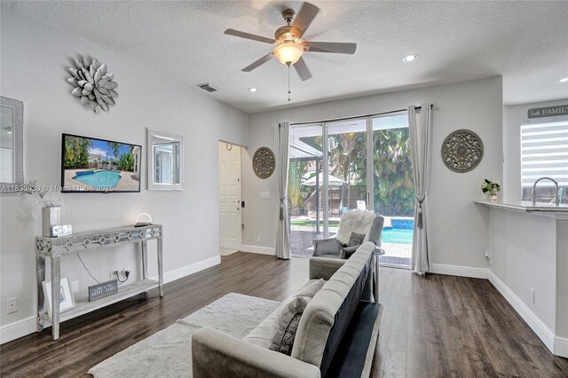 5347 SW 32nd Ter, Hollywood, FL 33312 - living room featuring a ceiling fan, a textured ceiling, wood finished floors, and recessed lighting