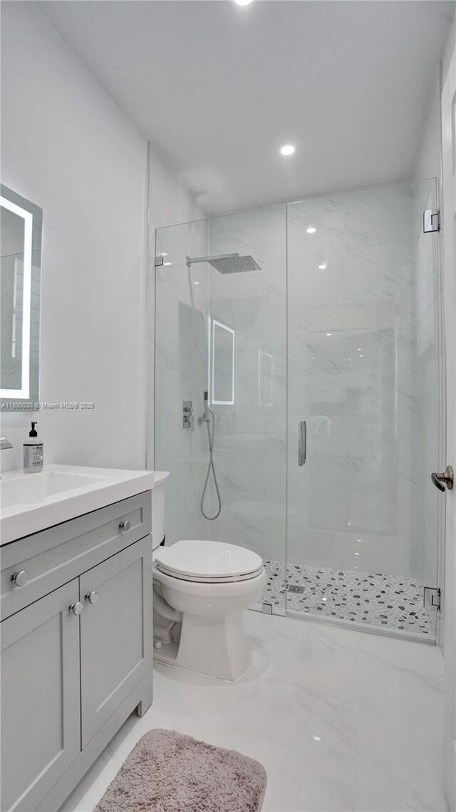 5347 SW 32nd Ter, Hollywood, FL 33312 - full bath featuring a marble finish shower, vanity, and recessed lighting