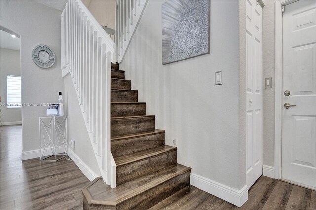 5347 SW 32nd Ter, Hollywood, FL 33312 - stairway featuring arched walkways and wood finished floors