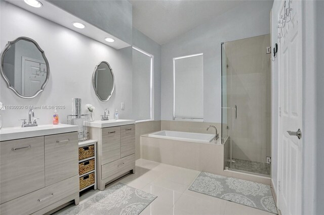 5347 SW 32nd Ter, Hollywood, FL 33312 - full bathroom with a shower stall, tile patterned flooring, two vanities, a garden tub, and recessed lighting