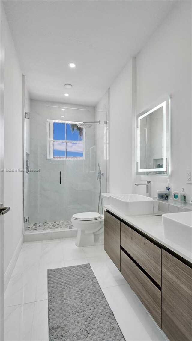 5347 SW 32nd Ter, Hollywood, FL 33312 - bathroom featuring double vanity, a shower stall, and recessed lighting