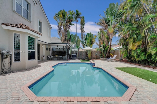 5347 SW 32nd Ter, Hollywood, FL 33312 - view of pool featuring a patio area, ceiling fan, a fenced backyard, and an outdoor living space