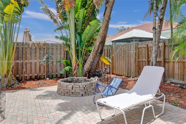 5347 SW 32nd Ter, Hollywood, FL 33312 - fenced backyard with a fire pit and a patio