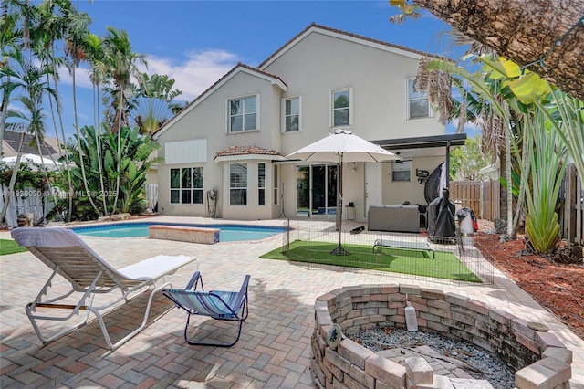 5347 SW 32nd Ter, Hollywood, FL 33312 - back of house featuring stucco siding, a fenced backyard, and a patio