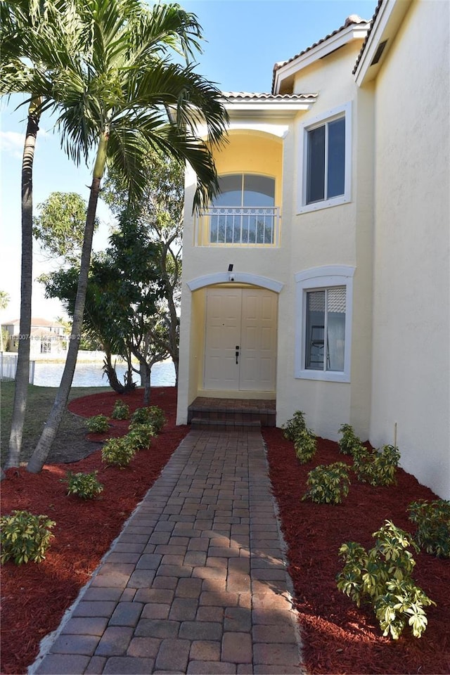 2925 SW 133rd Ave, Miramar, FL 33027 - doorway to property featuring stucco siding and a tile roof