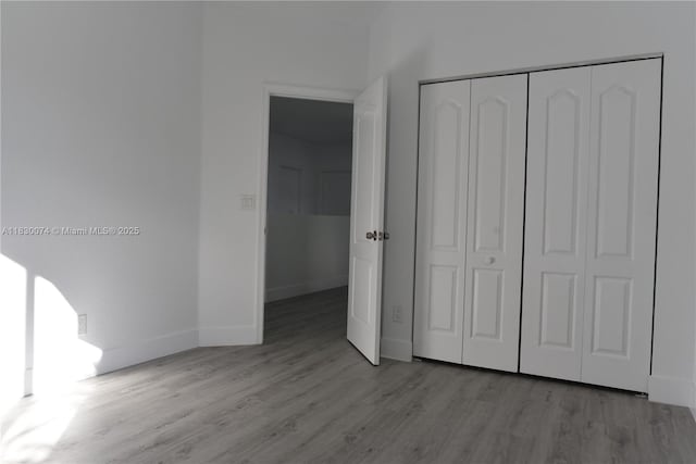 2925 SW 133rd Ave, Miramar, FL 33027 - unfurnished bedroom featuring wood finished floors and a closet